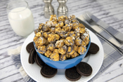 Cookies & Cream Poppin Popcorn in bowl on counter with ingredients