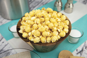 Kettle Corn Poppin Popcorn in bowl on counter with ingredients